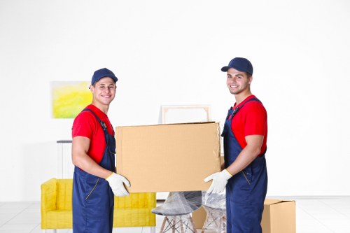 Packed boxes and furniture ready for small removals