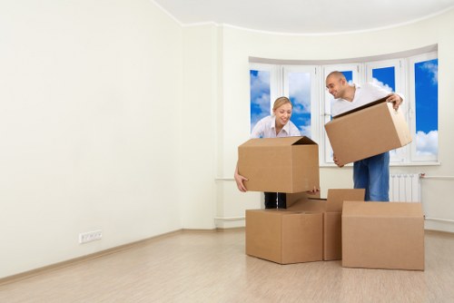 Movers carrying furniture near Lambeth homes