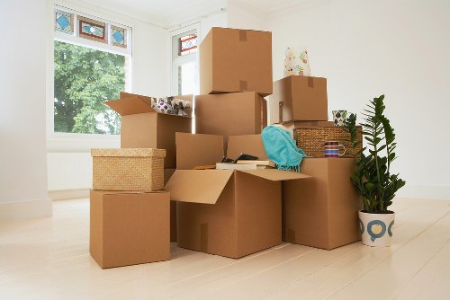 Professional removals team navigating stairs during a Lambeth flat move